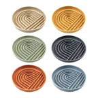 Six Collarva slow feeder dog bowl colors arranged together on a white background