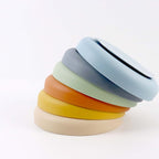 Stacked Collarva slow feeder bowls showing multicolor suction-cup bases