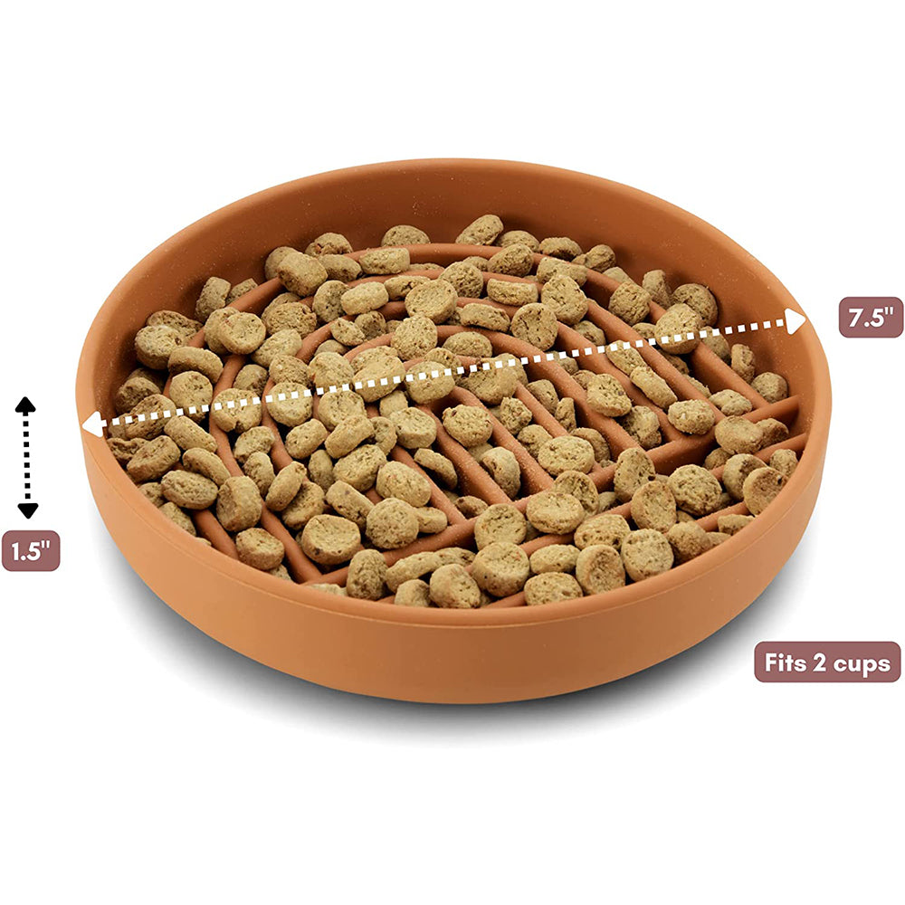 Terracotta Collarva slow feeder dog bowl filled with kibble, showing its two-cup capacity